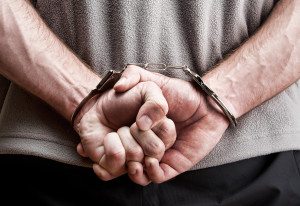 suspect locked in handcuffs